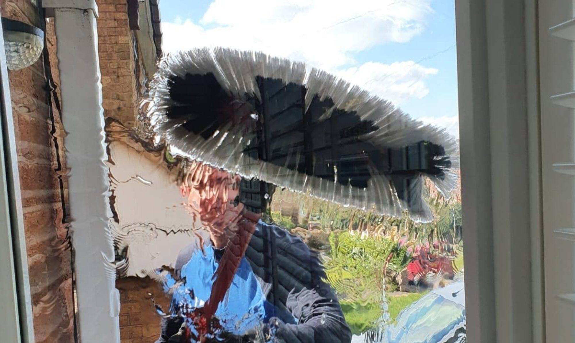Window cleaner working on a residential property